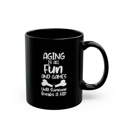 "Aging Is All Fun And Games Until Someone Breaks A Hip" Black Coffee Mug, 11 0z and 15 Oz